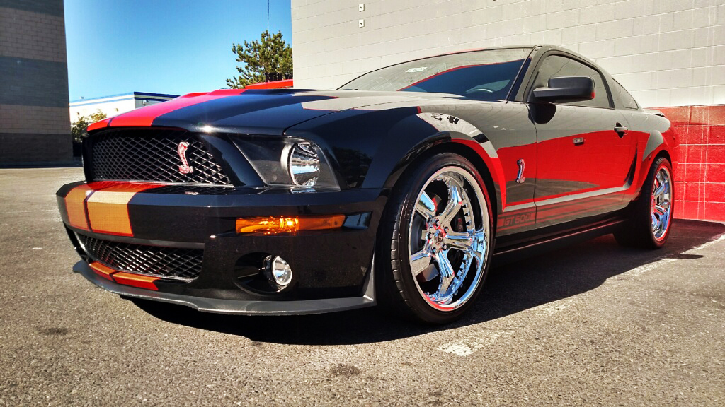 black muscle car orange stripes