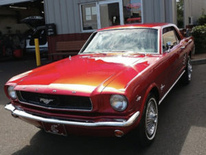 red ford mustang in lot